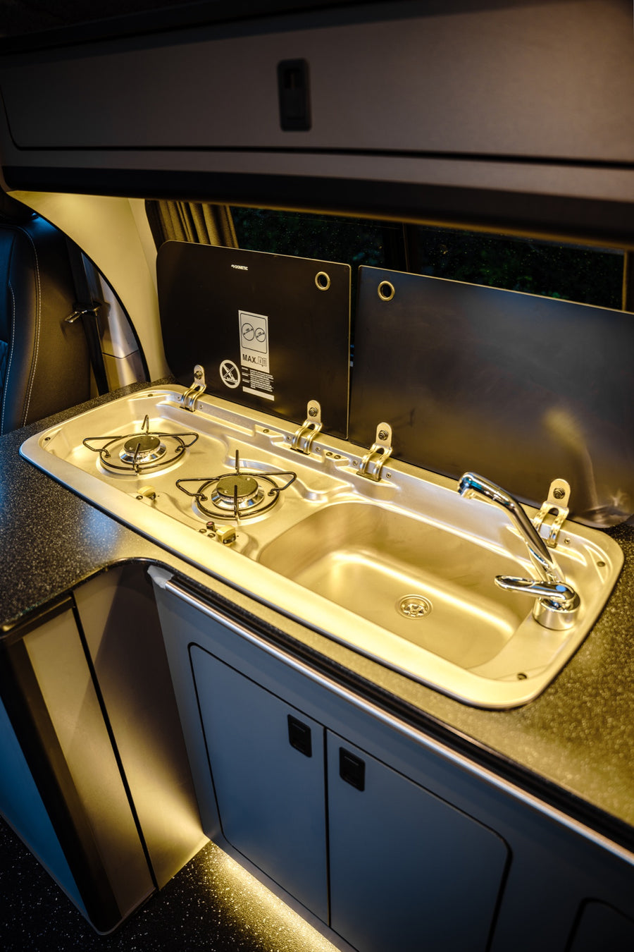 Fitted campervan kitchen with hob and sink
