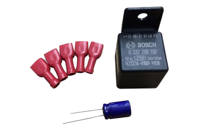 Black relay, blue capacitor, and five red electrical connectors for campervan wiring kits