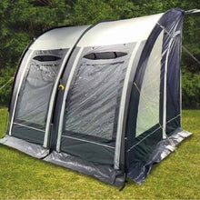 Inflatable campervan awning with clear windows set up on green grass outdoors