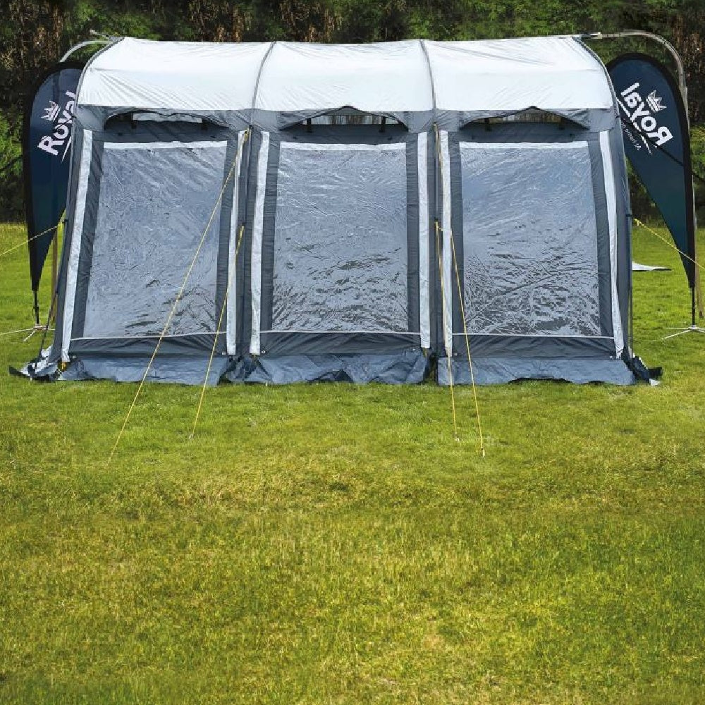 Large campervan driveway awning tent with clear windows set up on grassy field