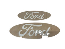 Two Ford logos cut into plywood from our cnc machine